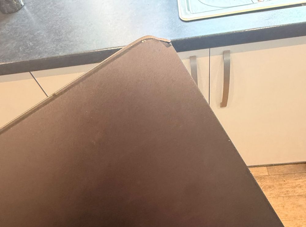 Tablet with a damaged screen and bent frame corner